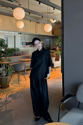 a lady wears a xiang yun silk shirt with matching pants